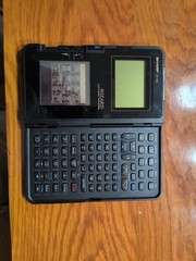 Sharp Wizard OZ-7000 Electronic Organizer Untested / For Parts